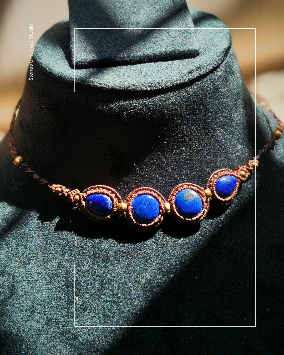 Boho style lapis lazuli necklace with brass bead accents.