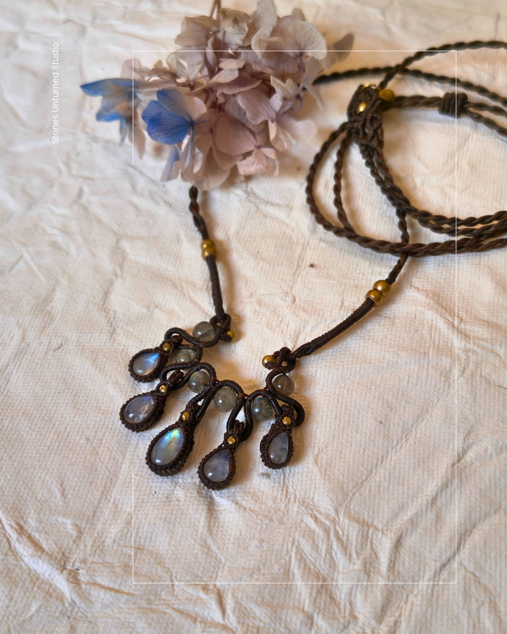 Handmade macrame necklace with rainbow moonstone dangles and labradorite stones.