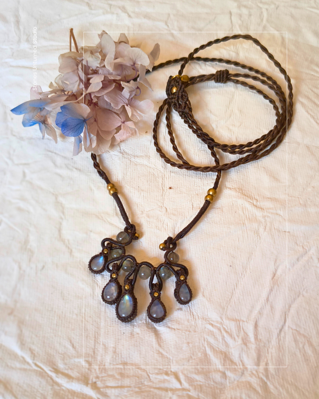 Boho moonstone necklace with blue flashes set in intricate micro macrame.