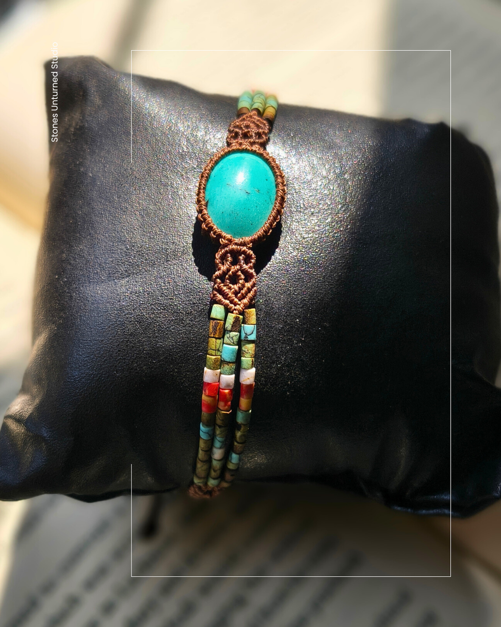 Close up of Iranian turquoise stone in handmade macrame bracelet.