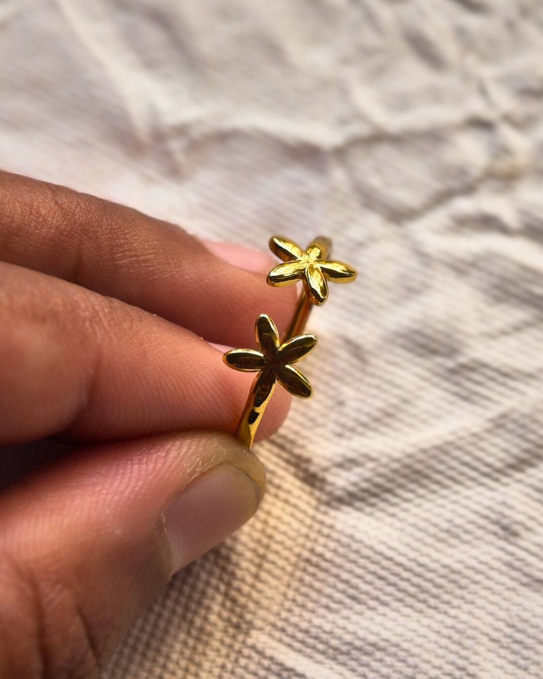 Minimal gold flower promise ring or friendship ring design.