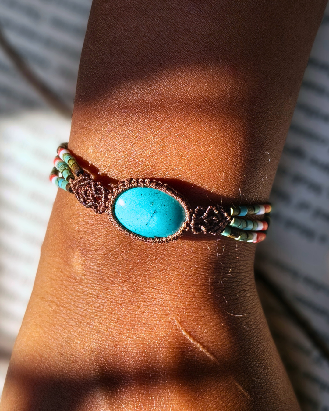 Boho turquoise bracelet with azure blue gemstone in micro macrame setting.