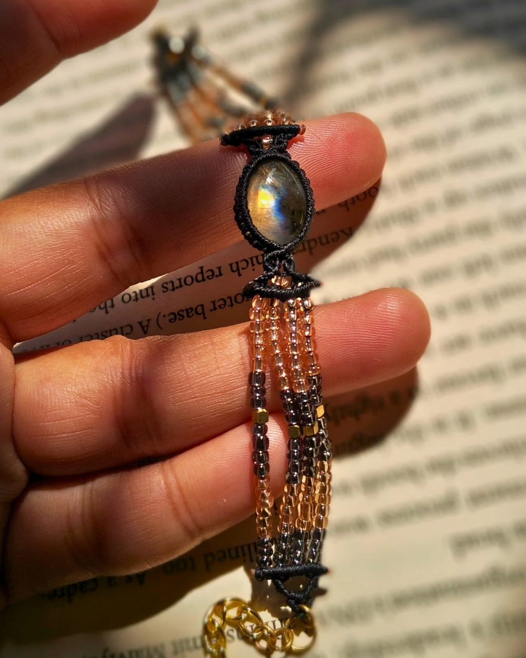 Boho style gemstone bracelet with labradorite stone and gold lobster clasp.