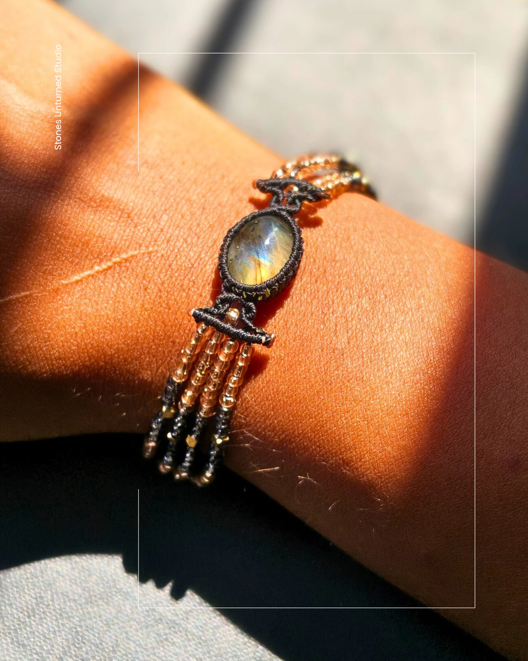 Handmade macrame beaded bracelet with natural labradorite stone and gold clasp.
