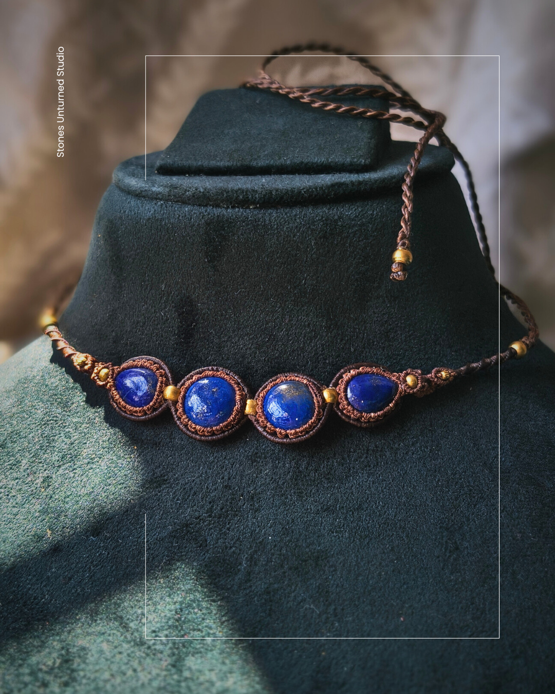 Lapis lazuli necklace with deep blue stones in handcrafted macrame design.