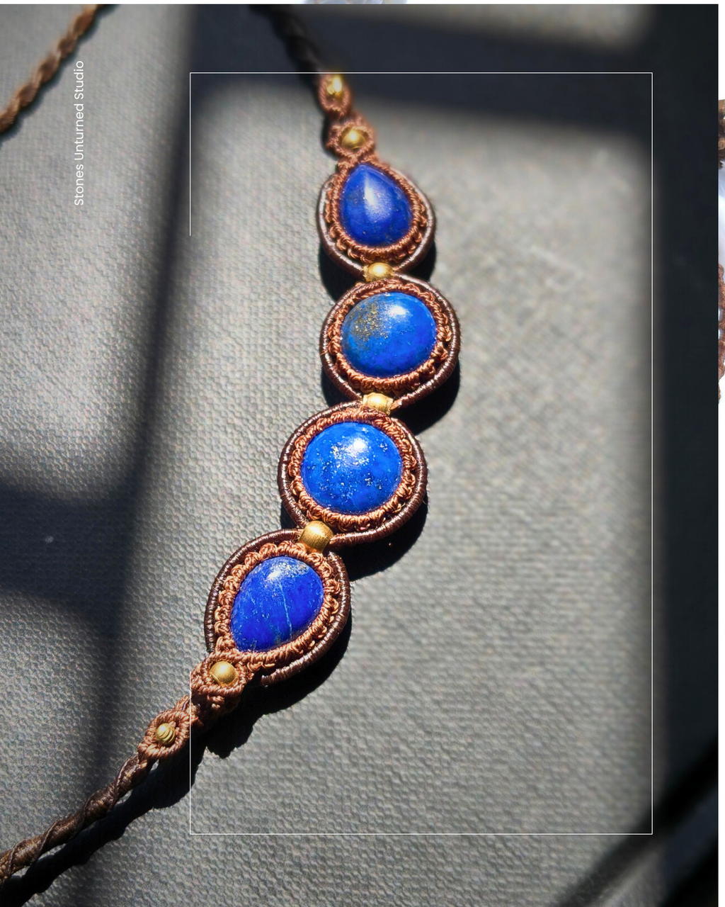 Adjustable macrame necklace featuring multiple lapis stones.