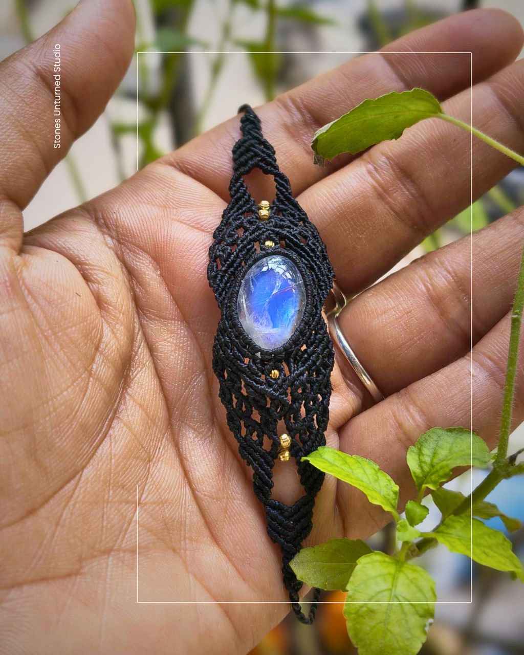 Artisan macramé bracelet with oval moonstone gemstone and intricate knotwork design