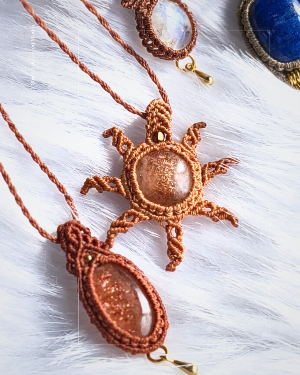 Macrame sun-shaped pendant with natural sunstone center on a white background