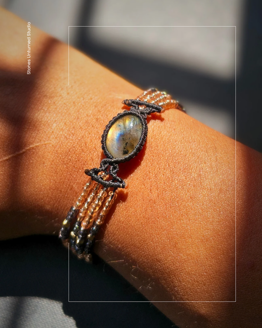 Flashy labradorite bracelet with rose gold and grey accent beads.
