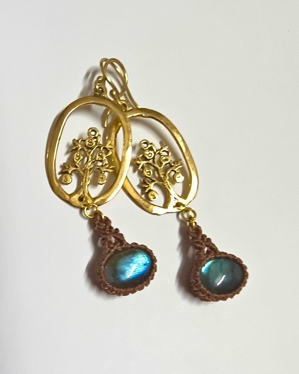 Nature-inspired handmade earrings with tree motif, brass detailing, and hand-knotted macramé