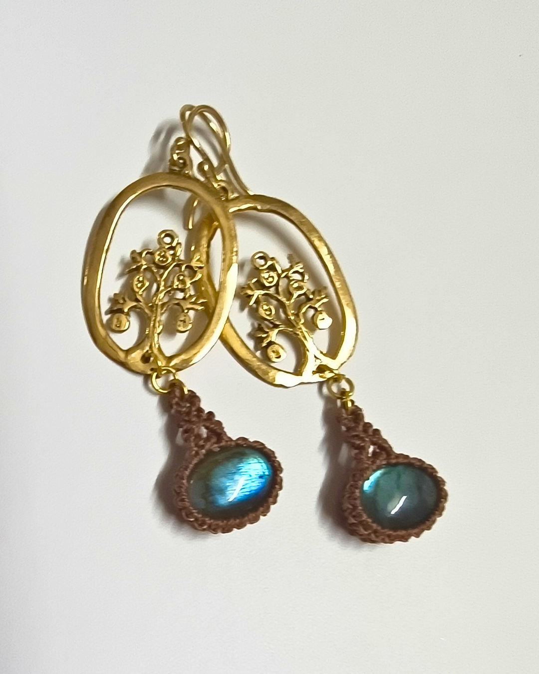 Nature-inspired handmade earrings with tree motif, brass detailing, and hand-knotted macramé