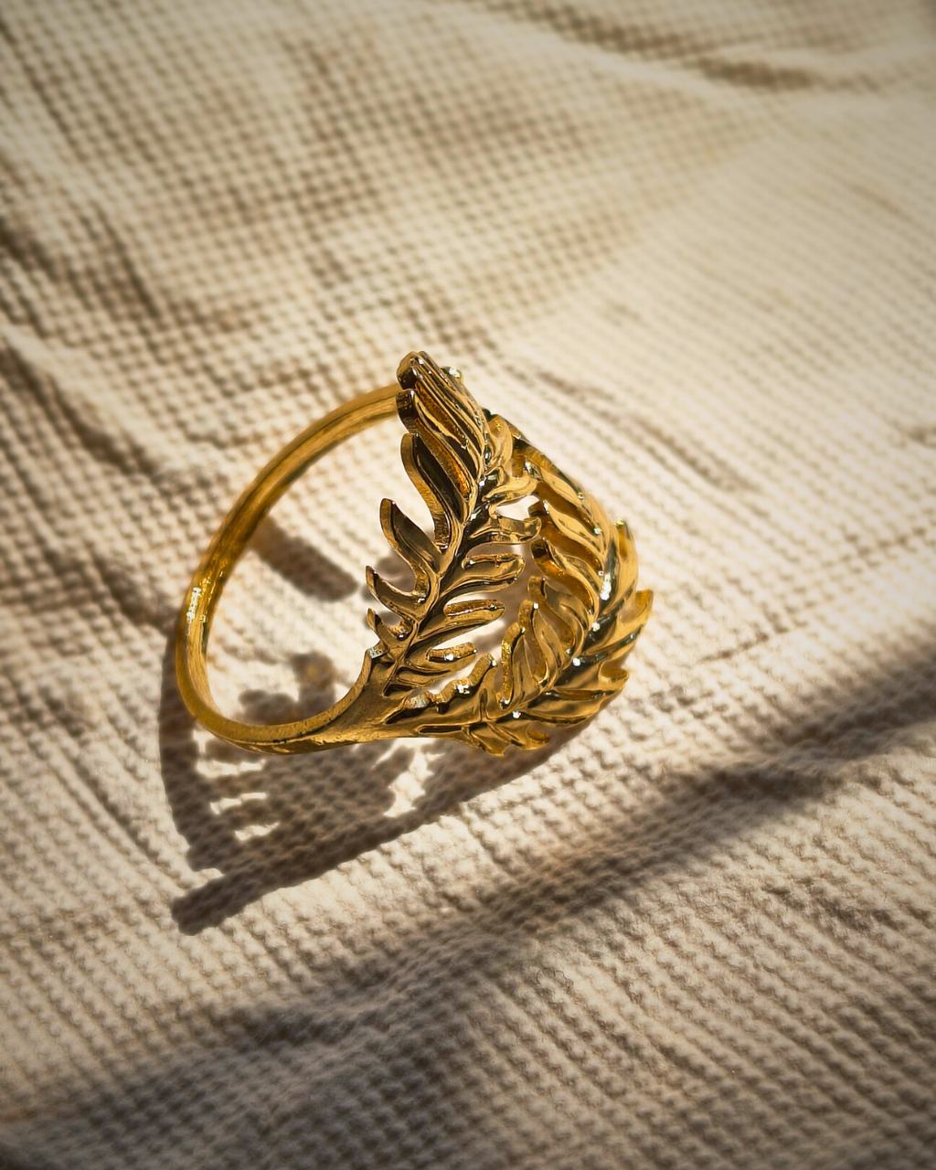Minimalist botanical gold ring inspired by fern leaves and natural shapes