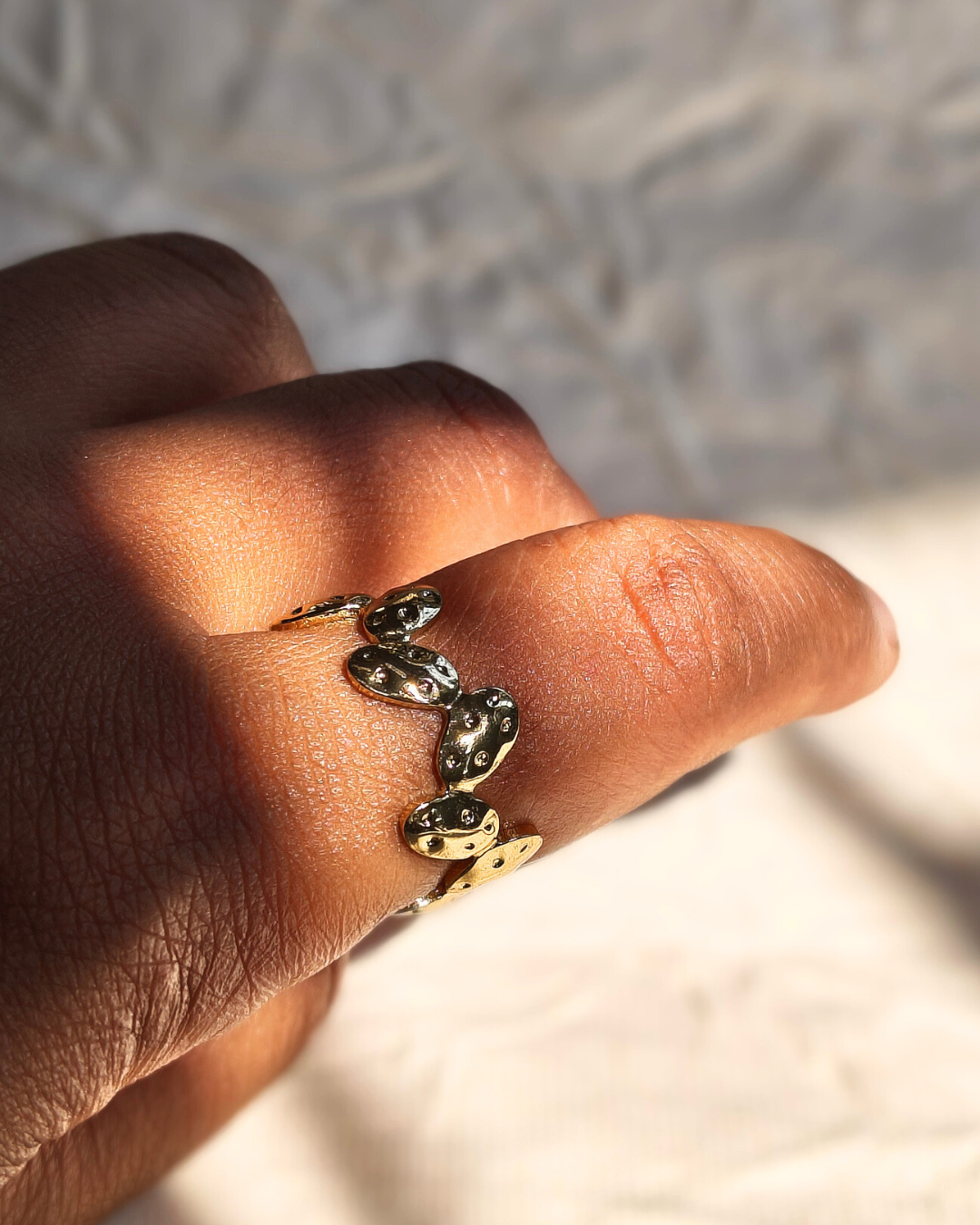 Modern gold stacking ring inspired by smooth pebbles