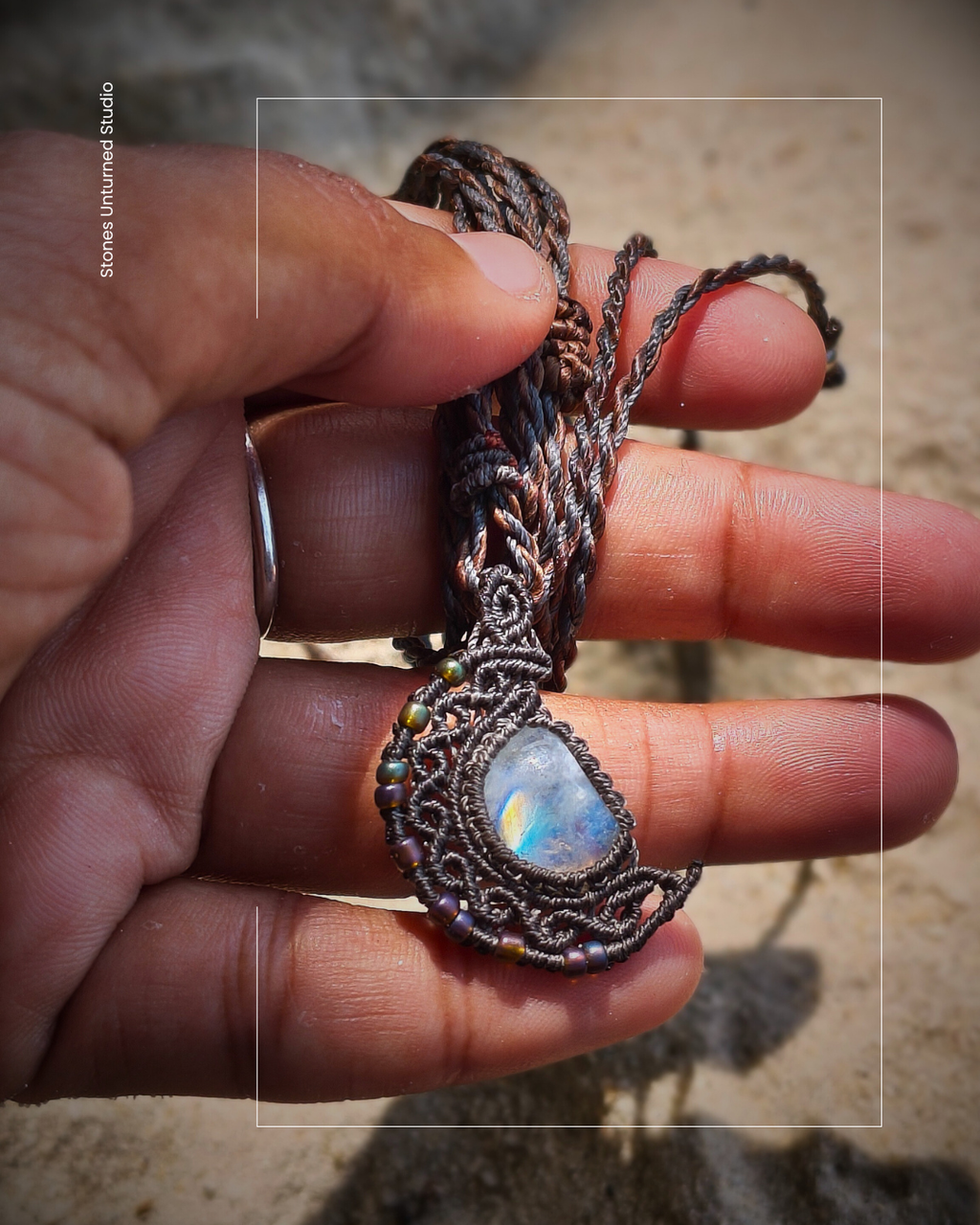 Handmade macramé crescent moon pendant with natural moonstone gemstone in dark cord