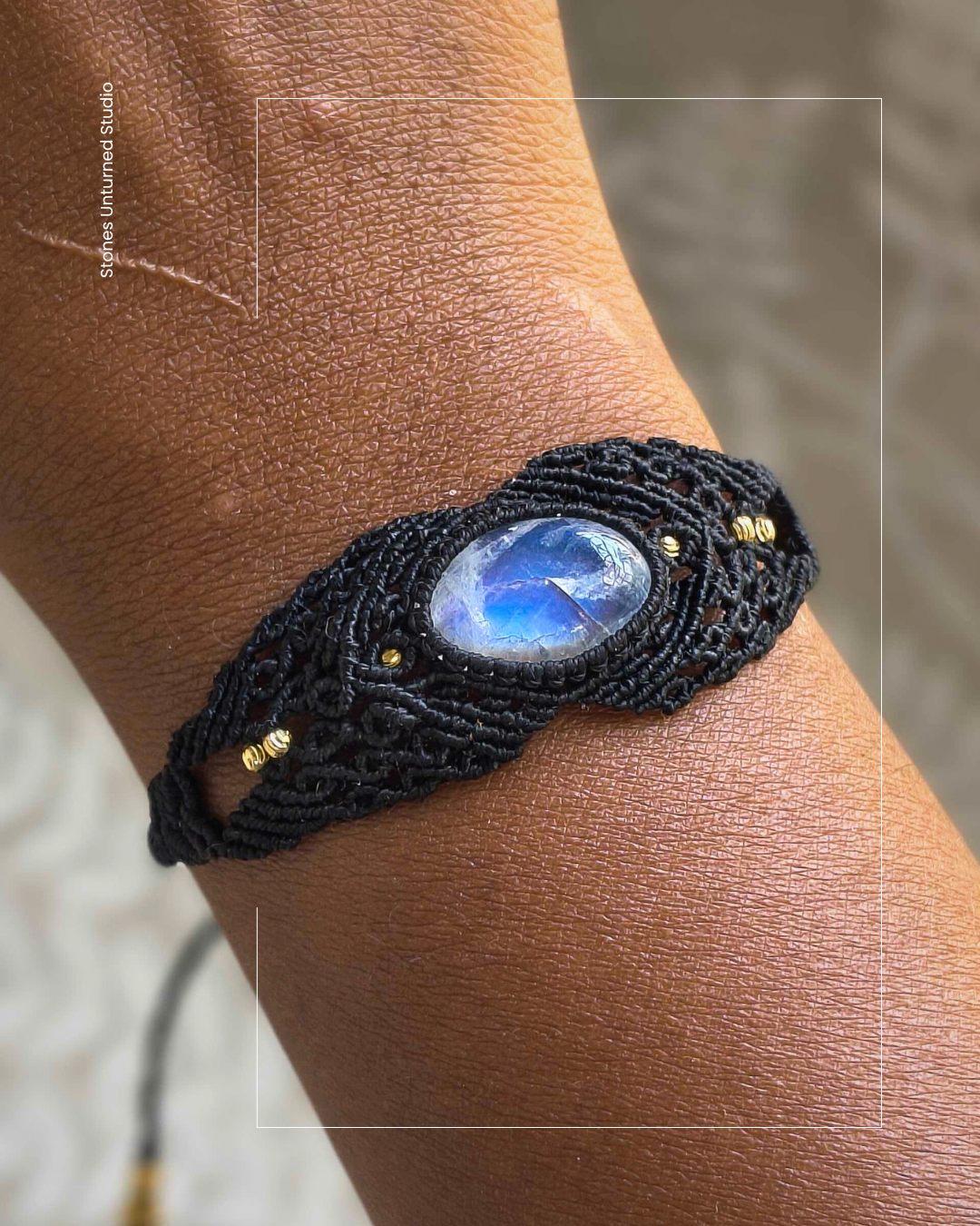 Close-up of handmade macramé bracelet featuring natural moonstone crystal centerpiece