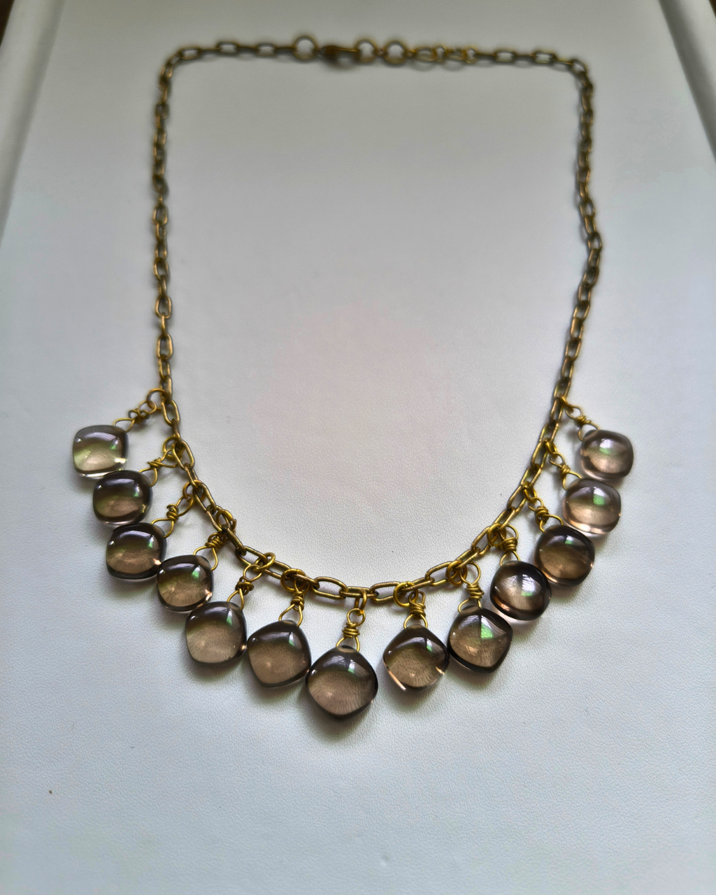 Detailed view of high-grade Brazilian Smoky Quartz crystal beads hand wrapped to create a flowing artisan necklace.