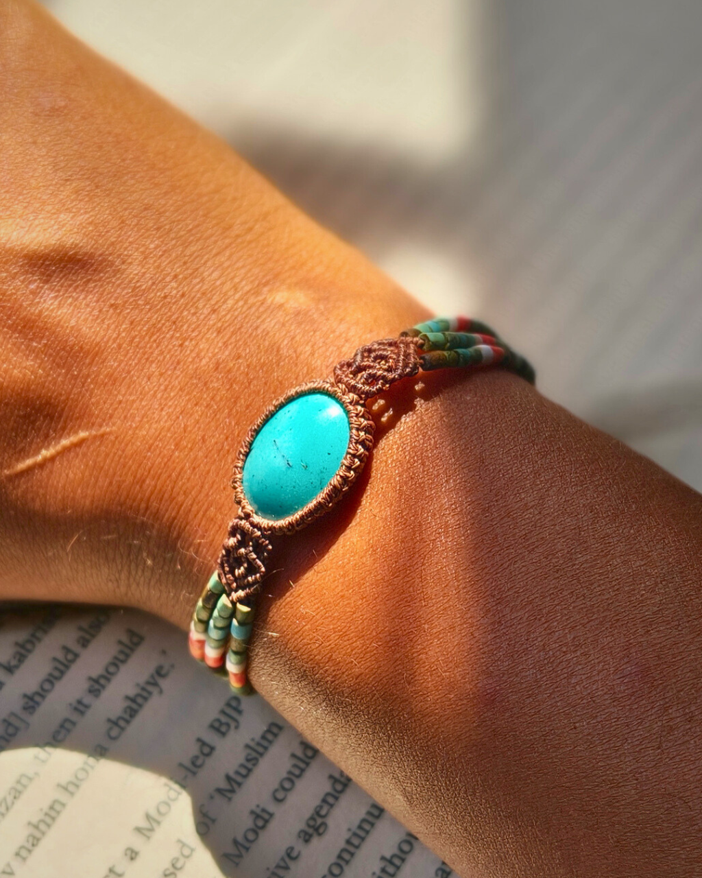 Handmade macrame bracelet with Iranian turquoise stone and colorful bead strands.