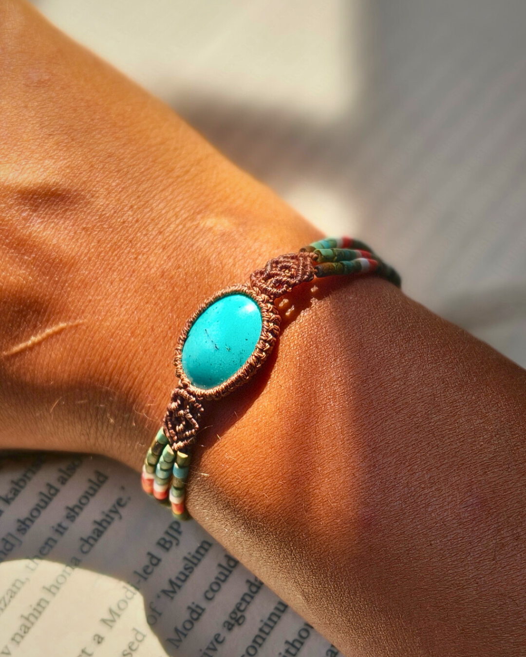 Handmade macrame bracelet with Iranian turquoise stone and colorful bead strands.
