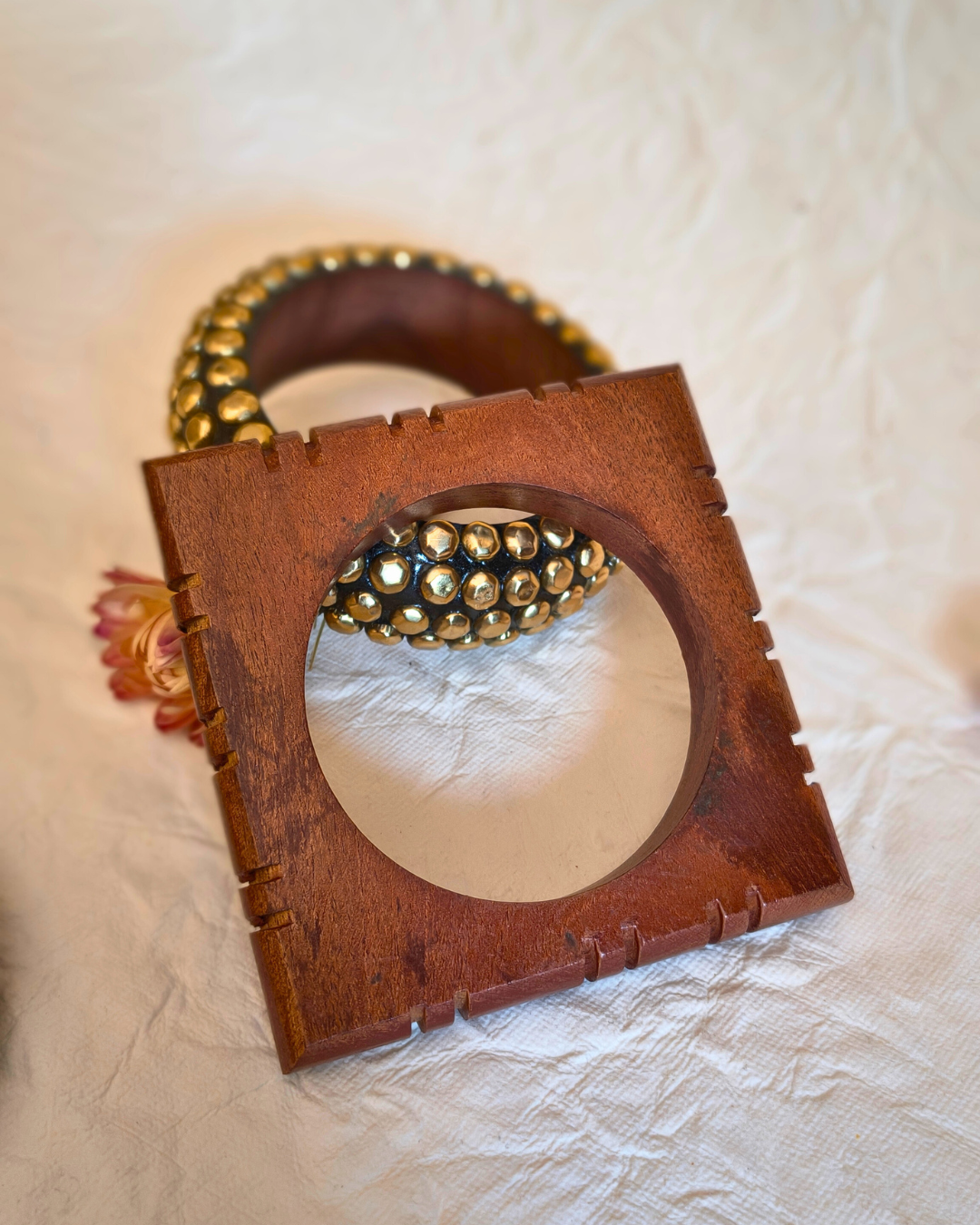 Boho style wooden bangle set with mixed shapes and natural finish.