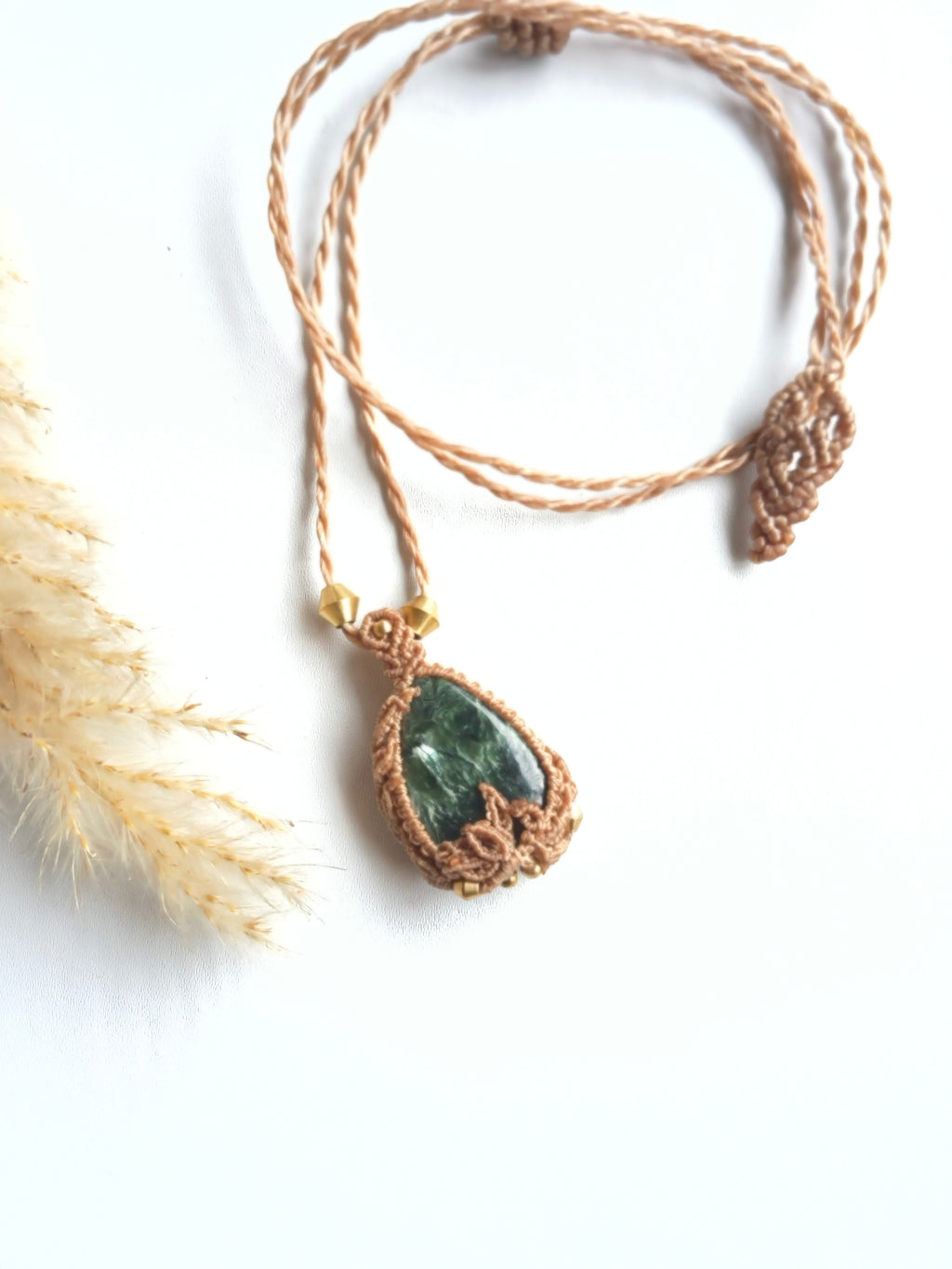 Seraphinite pendant necklace with adjustable brass-capped cord and end details also the depth of green of the natural gemstone