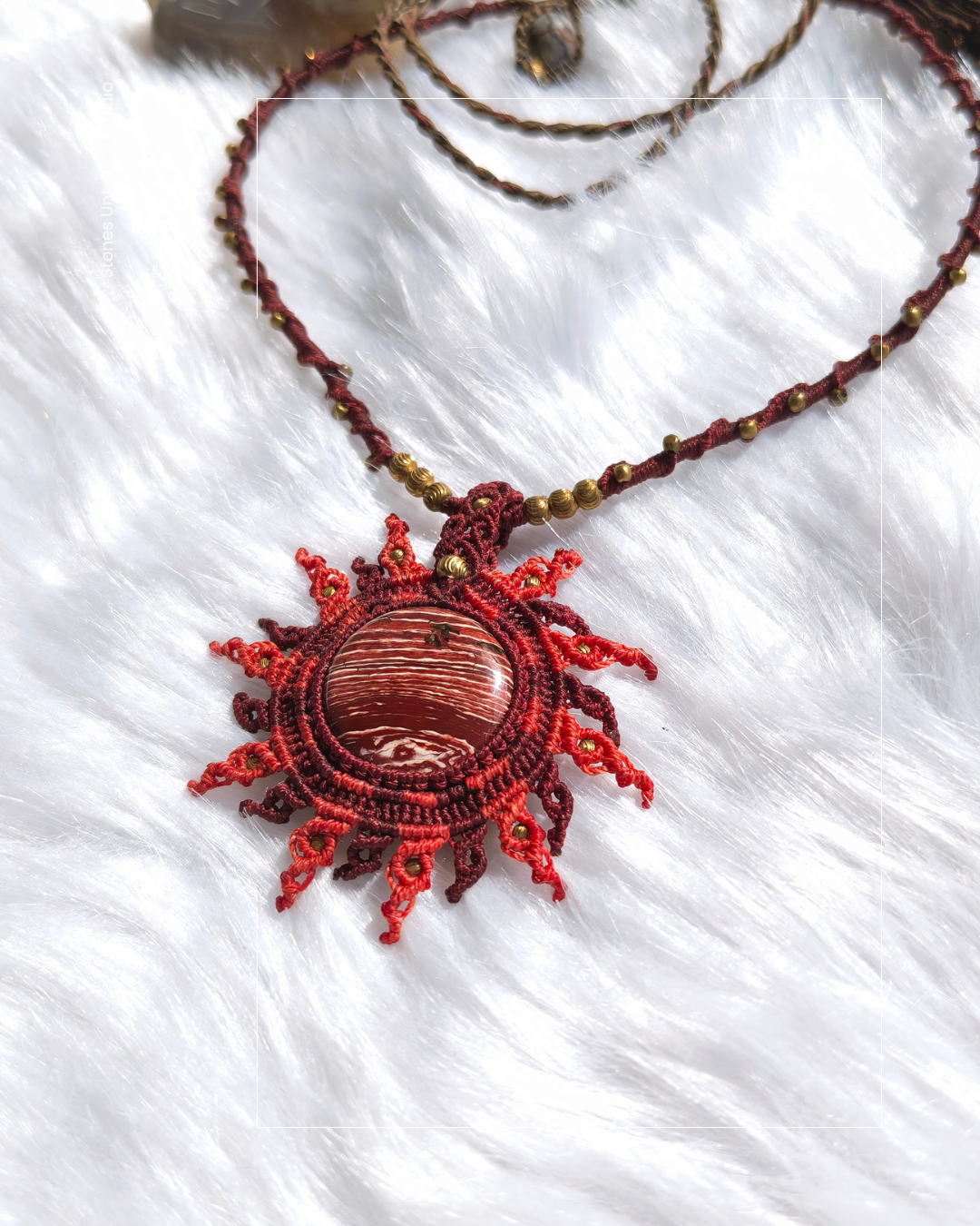 Handmade rainbow jasper sun pendant with macrame sunray design and brass bead necklace