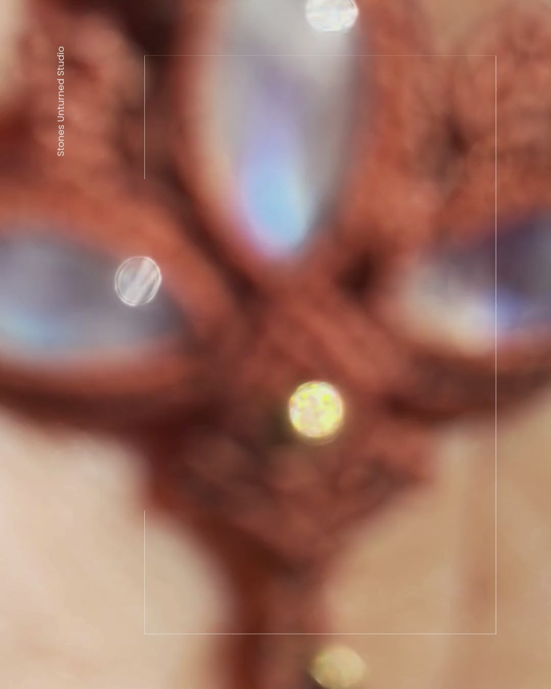 Video of handmade lotus moonstone macrame pendant shimmering with blue flash as it moves in natural light.
